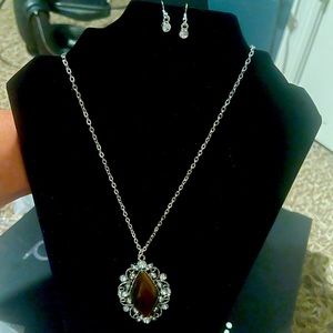 Necklace and earring set one size fits all.